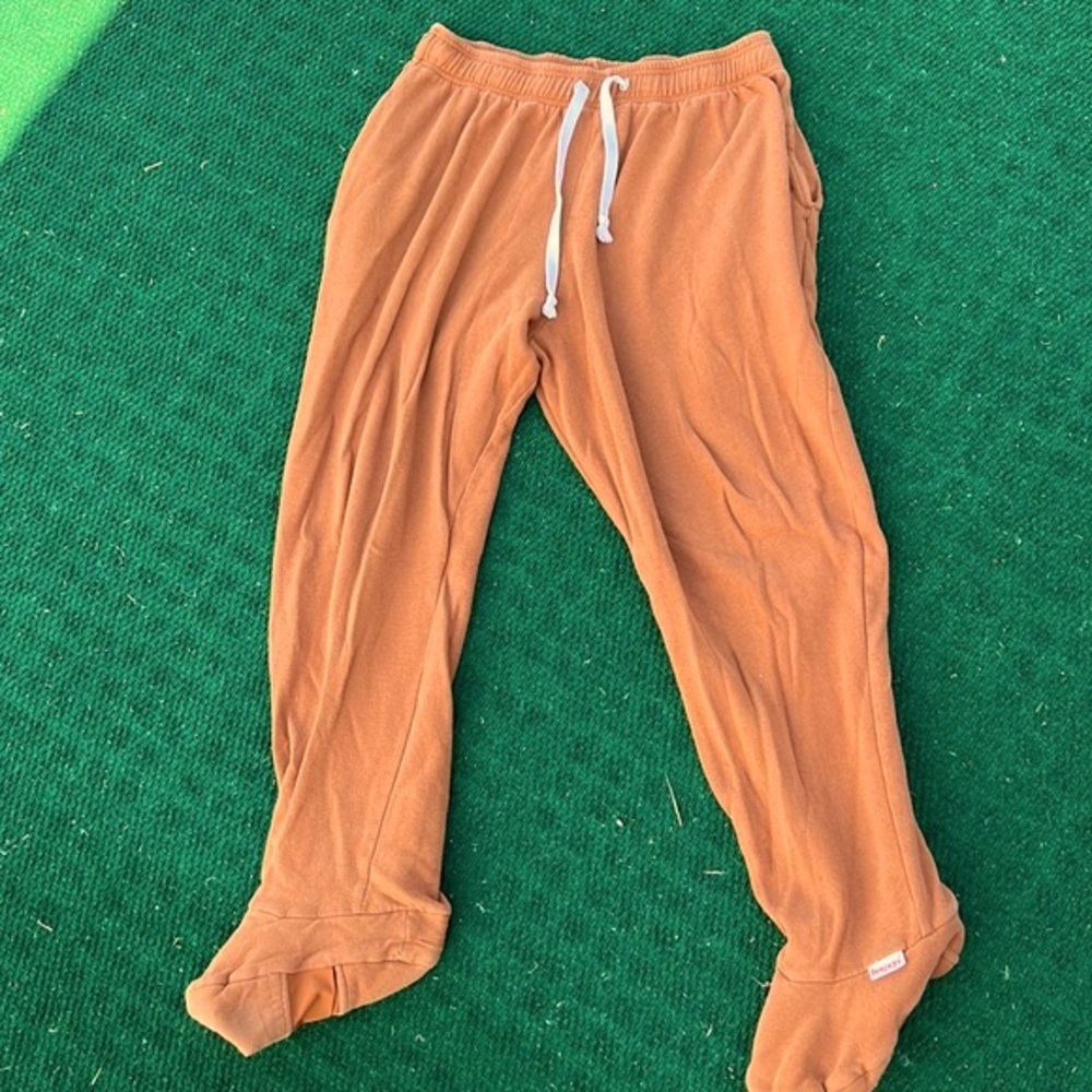 Feejays sweat pants with feet. Pockets on each side. Rust brown. Fair condition